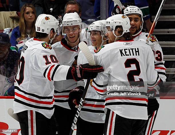 Patrick Sharp, Jonathan Toews, Patrick Kane, Duncan Keith and Dustin Byfuglien of the Chicago Blackhawks celebrate after scoring in Game Four of the...