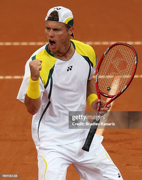 Lleyton Hewitt of Australia pumps his fist as he celebrates winning a point during his doubles match against Takao Suzuki and Go Soeda of Japan...