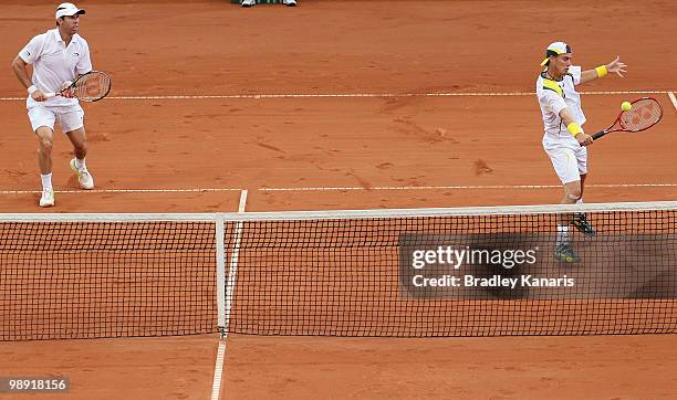 Lleyton Hewitt of Australia plays a backhand during his doubles match against Takao Suzuki and Go Soeda of Japan during the match between Australia...