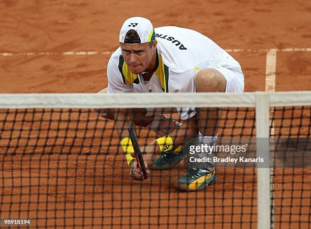 Lleyton Hewitt of Australia prepares to return serve during his doubles match against Takao Suzuki and Go Soeda of Japan during the match between...