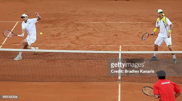 Paul Hanley of Australia plays a forehand during his doubles match against Takao Suzuki and Go Soeda of Japan during the match between Australia and...