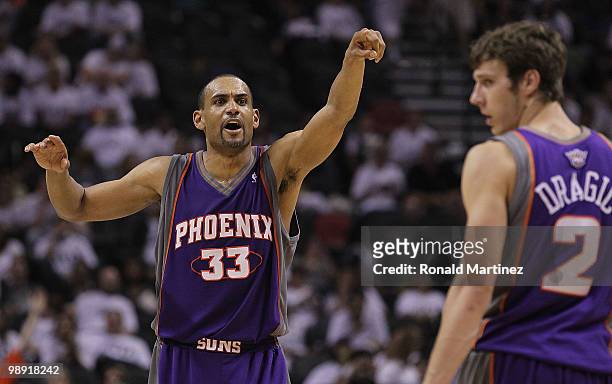 Forward Grant Hill of the Phoenix Suns reacts with Goran Dragic during a 110-96 win against the San Antonio Spurs in Game Three of the Western...