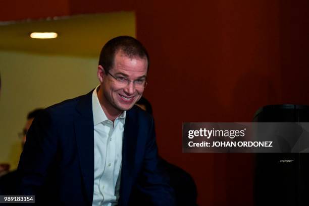 Mexico's presidential candidate for the "Mexico al Frente" coalition Ricardo Anaya leaves after a press conference after getting the preliminary...