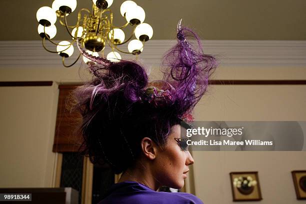 Model prepares backstage at the Romance Was Born collection show at the University of Sydney during Rosemount Australian Fashion Week Spring/Summer...