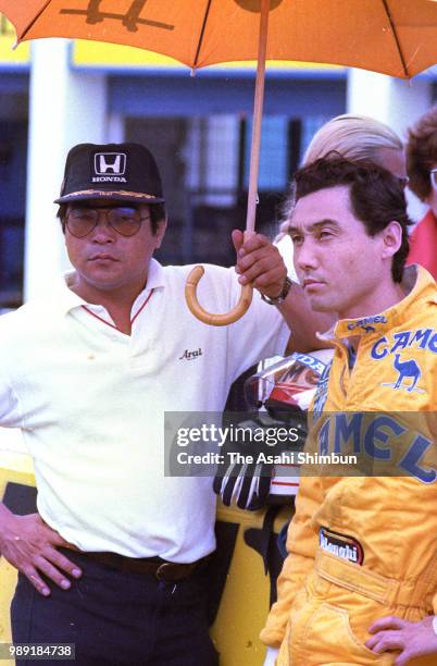 Satoru Nakajima of Japan and Lotus-Honda and his manager Naomichi Fukuda are seen during the Formula One Spanish Grand Prix at Circuito de Jerez on...