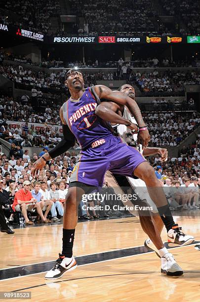 Amar'e Stoudemire of the Phoenix Suns defends the basket against Antonio McDyess of the San Antonio Spurs in Game Three of the Western Conference...