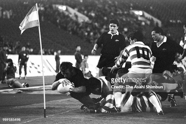 Andy Earl of the All Blacks scores a try during the rugby...