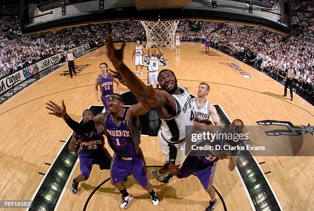 DeJuan Blair of the San Antonio Spurs fights for the rebound against Amar'e Stoudemire of the Phoenix Suns in Game Three of the Western Conference...