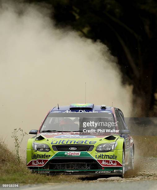 Mikko Hirvonen and Jarmo Lehtinen of Finland drive their Ford Focus RS WRC during stage 12 of the WRC Rally of New Zealand on the Te Akau Coast on...