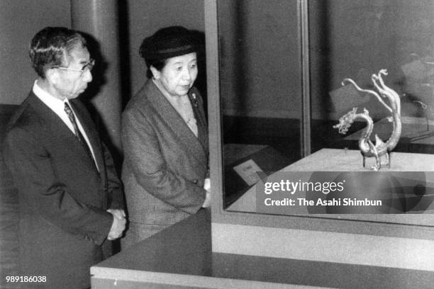 Prince Mikasa and Princess Yuriko of Mikasa watch exhibit at Tennoji Exhibition on October 31, 1987 in Osaka, Japan.