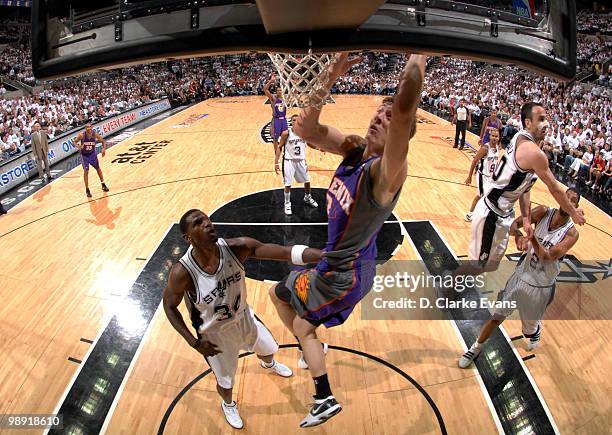 Gordan Dragic of the Phoenix Suns shoots against Antonio McDyess of the San Antonio Spurs in Game Three of the Western Conference Semifinals during...