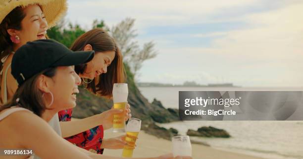 young people having fun on the beach. - asian person bbq stock pictures, royalty-free photos & images