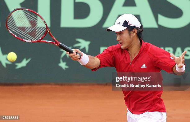 Go Soeda of Japan plays a forehand during his doubles match against Lleyton Hewitt and Paul Hanley of Australia during the match between Australia...