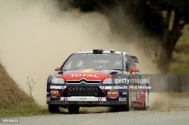 Sebastien Ogier and co-driver Julien Ingrassia of France drive their Citroen C4 WRC during stage 12 of the WRC Rally of New Zealand at the At Akau...