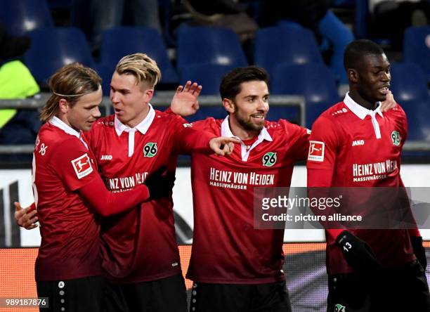Hannover's Felix Klaus celebrating his scoring of the 3:2 with teammates Iver Fossum , Julian Korb and Ihlas Bebou during the German Bundesliga...