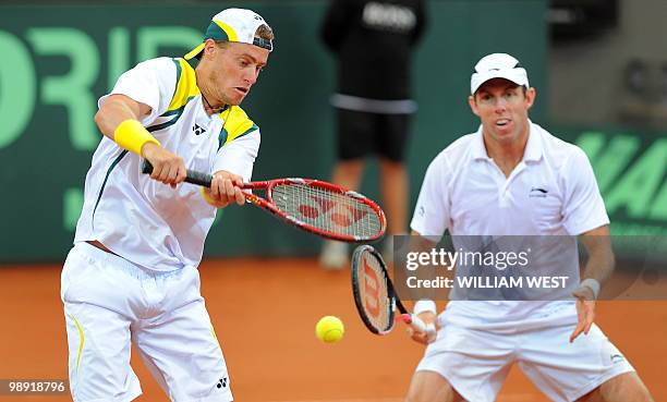 Lleyton Hewitt and Paul Hanely of Australia hit a return on the way to defeating Japan's Takao Suzuki and Go Soeda during their Davis Cup tennis tie...