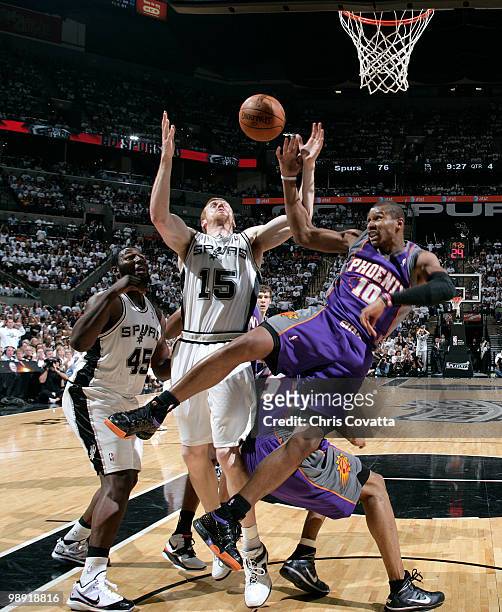 Leandro Barbosa of the Phoenix Suns fights for loose ball with Matt Bonner of the San Antonio Spurs in Game Three of the Western Conference...
