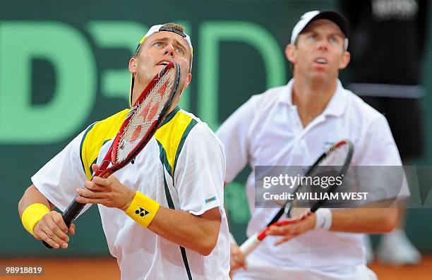 Lleyton Hewitt and Paul Hanely of Australia keep their eyes on a lob on the way to defeating Japan's Takao Suzuki and Go Soeda during their Davis Cup...