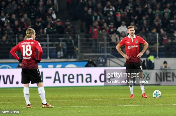 Hannover's Iver Fossum and Niclas Fullkrug standing on the pitch during the German Bundesliga soccer match between Hannover 96 and Bayer Leverkusen...