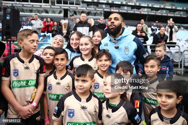 Josh Addo-Carr meets young participents during the New South Wales Blues State of Origin Team Announcement at ANZ Stadium on July 2, 2018 in Sydney,...