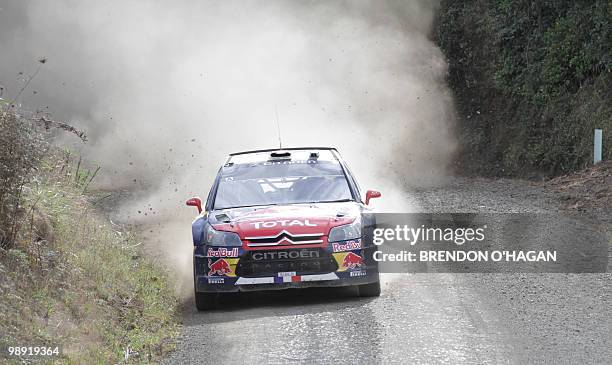 Citroen Total world rally team drivers in a Citroen C4, Sebastien Loab of France and co driver Daniel Elena drive during day 2 of the Rally New...