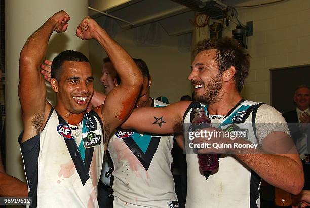 Danyle Pearce and Tom Logan of the Power celebrate in the rooms after winning the round seven AFL match between the Essendon Bombers and the Port...