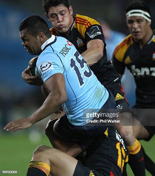 Kurtley Beale of the Waratahs barges through the Chiefs defence during the round 13 Super 14 match between the Chiefs and the Waratahs at Waikato...