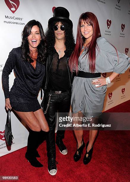 Model Janice Dickinson, musician Slash and Perla Hudson arrive at the 6th Annual MusiCares MAP Fund Benefit Concert at Club Nokia on May 7, 2010 in...