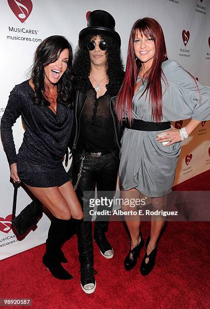 Model Janice Dickinson, musician Slash and Perla Hudson arrive at the 6th Annual MusiCares MAP Fund Benefit Concert at Club Nokia on May 7, 2010 in...