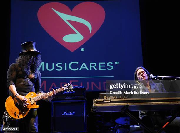 Musician Slash and singer Beth Hart perform at MusiCares MAP Fund benefit concert at Club Nokia on May 7, 2010 in Los Angeles, California.