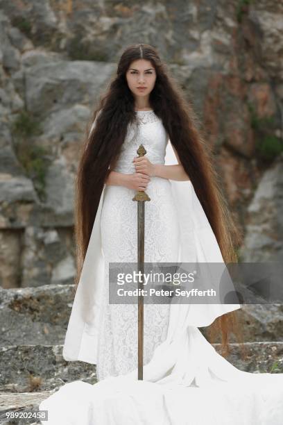 reminiscence to joan of arc, jeanne d'arc, young woman in a white dress with a sword - jeanne darc stock pictures, royalty-free photos & images