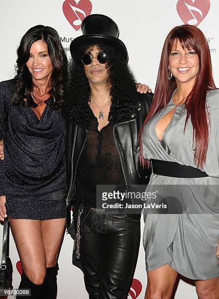 Janice Dickinson, Slash and Perla Ferrar attend the 6th annual MusiCares MAP Fund benefit concert at Club Nokia on May 7, 2010 in Los Angeles,...