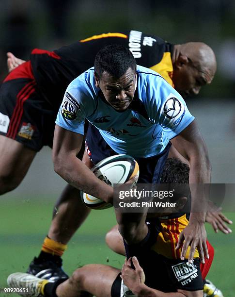 Kurtley Beale of the Waratahs is wrapped up by the Chiefs defence during the round 13 Super 14 match between the Chiefs and the Waratahs at Waikato...