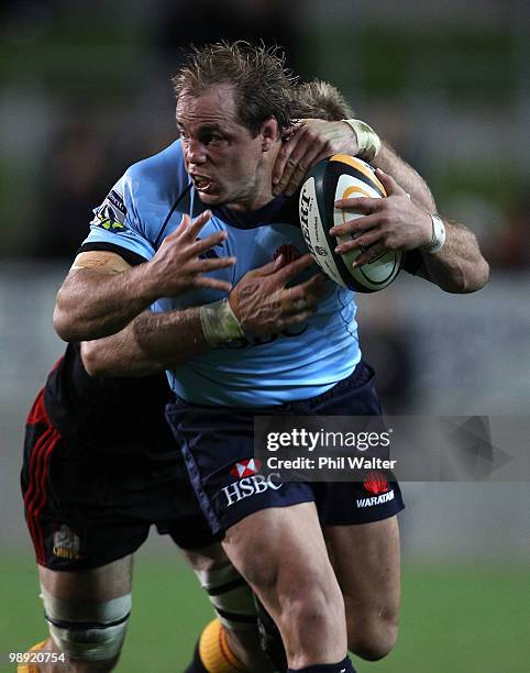 Phil Waugh of the Waratahs is tackled during the round 13 Super 14 match between the Chiefs and the Waratahs at Waikato Stadium on May 8, 2010 in...