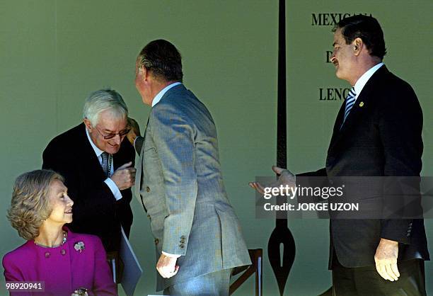 Victor Garcia de la Concha , director of the Academia espanola de la lengua, greets King Juan Carlos of Spain , next to Queen Sofia of Spain and the...