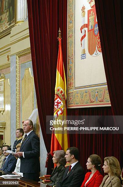 King Juan Carlos of Spain adresses deputies as Queen Sofia , Prince Felipe , Princess Elena and Princess Cristina look on, in Spain's Parliament,...