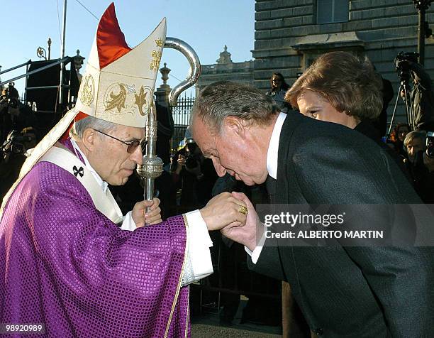 King Juan Carlos of Spain pays his respects to Madrid's Cardinal Antonio Maria Rouco Varela before a funeral mass in memory of Pope John Paul II at...