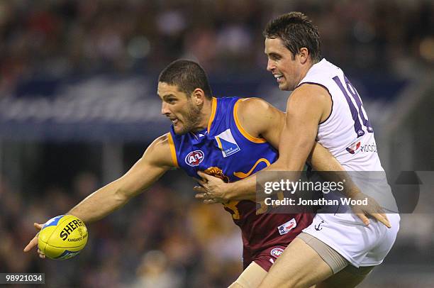 Brendan Fevola of the Lions contests the ball with Luke McPharlin of the Dockers during the round seven AFL match between the Brisbane Lions and the...