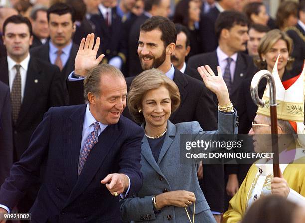 King Juan Carlos , Queen Sofia and Prince Felipe of Spain leave Madrid cathedral 09 November with Cardinal Antonio Maria Rouco Varela after a mass...