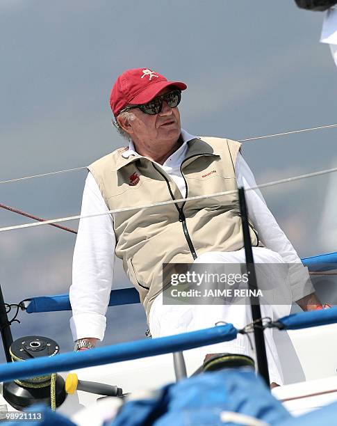 Spain's King Juan Carlos takes part in the first day of racing in the Breitling regatta on board Bribon on July 22, 2008 at Puerto Portals in Palma...