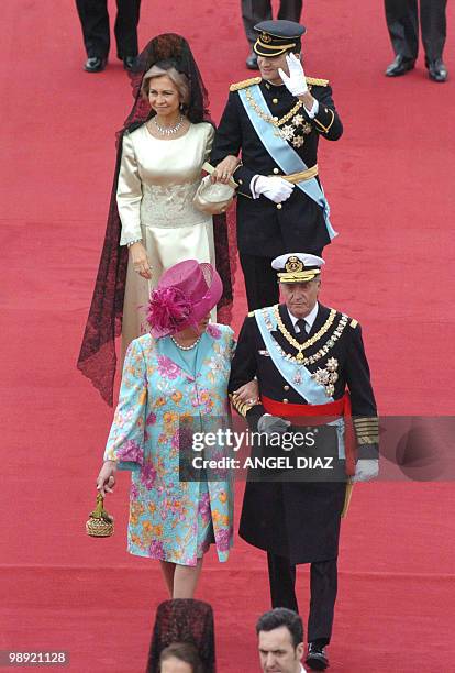 King Juan Carlos of Spain and his sister Princess Margarita walk ahead of Queen Sofia of Spain and her son Crown Prince Felipe of Bourbon between the...