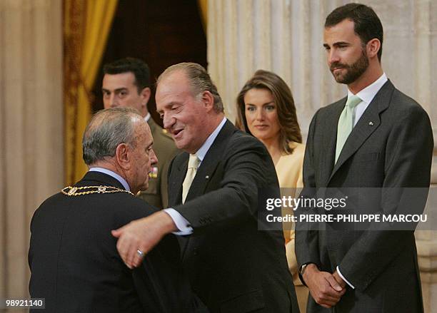 King Juan Carlos of Spain greets Galicia President Manuel Fraga , who was decorated as Father of the Spanish Constitution, in the presence of Crown...