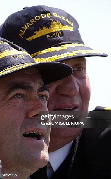 Spain's King Juan Carlos and Spanish Defence Minister Jose Bono observe military operations from the "Alvaro de Bazan" bridge, a Spanish navy ship,...