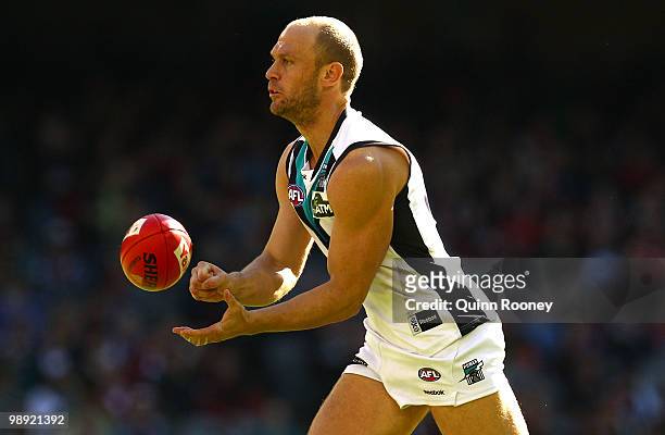 Chad Cornes of the Power handballs during the round seven AFL match between the Essendon Bombers and the Port Adelaide Power at Etihad Stadium on May...