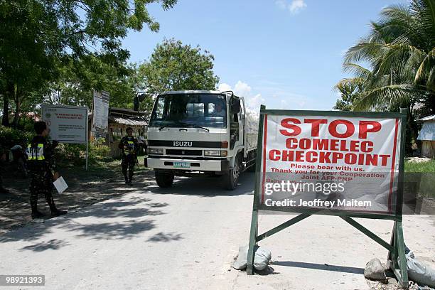 Philippine security forces inspect motorists on May 8, 2010 in Shariff Aguak, Maguindanao Province, Philippines. Shariff Aguak was the location of a...