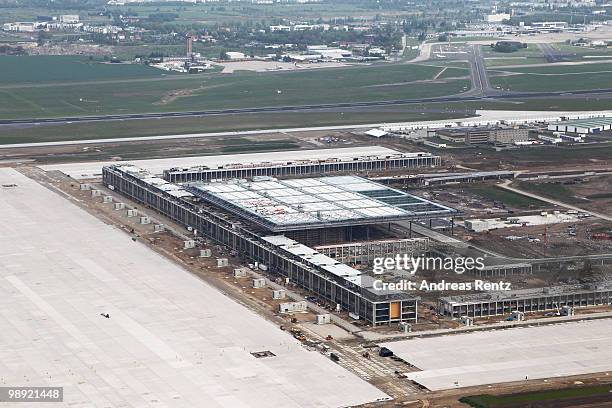 In this aerial view the new main terminal and the construction site of the new Airport Berlin Brandenburg International BBI are pictured on May 8,...