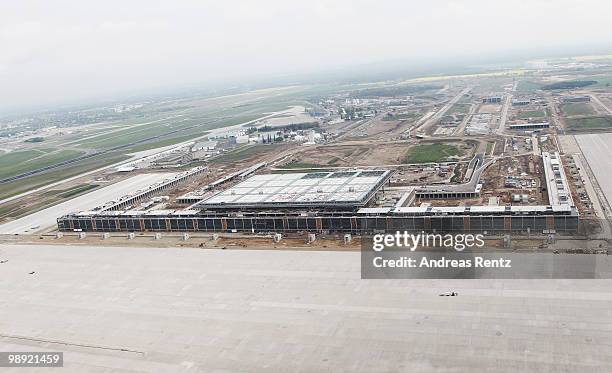 In this aerial view the new main terminal and the construction site of the new Airport Berlin Brandenburg International BBI are pictured on May 8,...