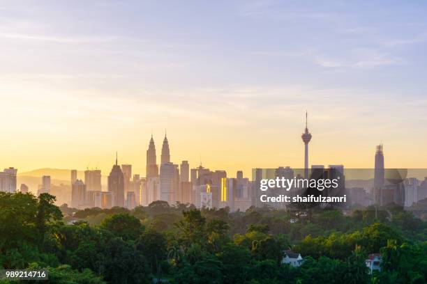 majestic sunrise over downtown kuala lumpur, malaysia - shaifulzamri stock pictures, royalty-free photos & images