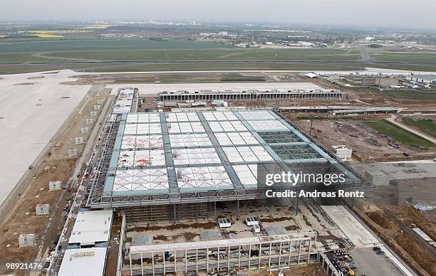 In this aerial view the new main terminal and the construction site of the new Airport Berlin Brandenburg International BBI are pictured on May 8,...