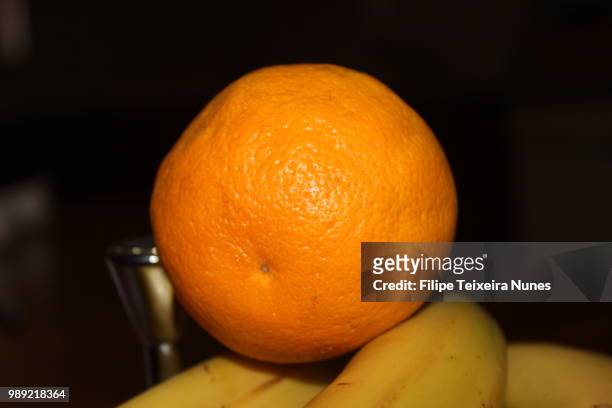 orange & bananas - filipe teixeira stock pictures, royalty-free photos & images
